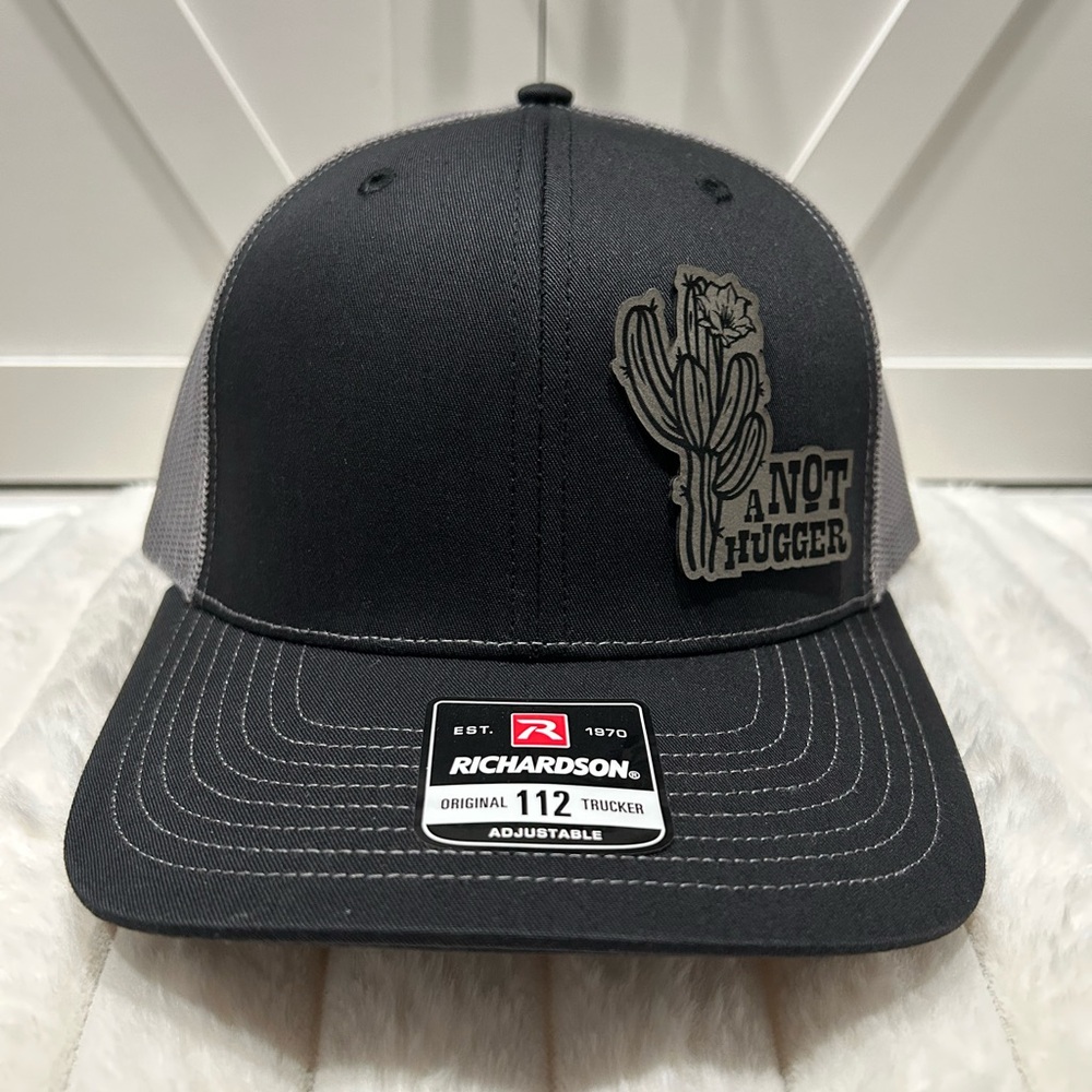 Not a hugger Laser engraved Richardson trucker hat.